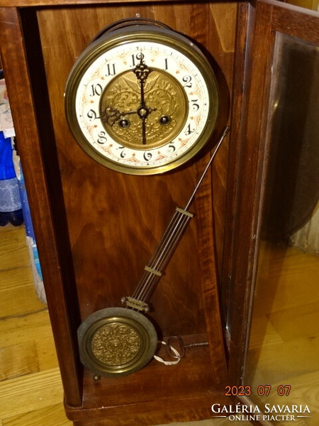 Antique chiseled wall clock mechanism with walker in plain case