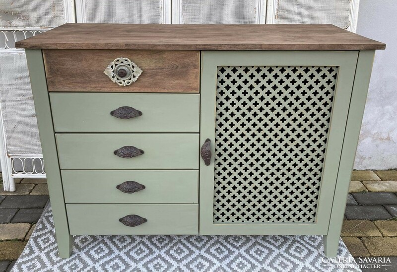 Chest of drawers with an oriental feel, antiqued with gold, with cast iron handles...