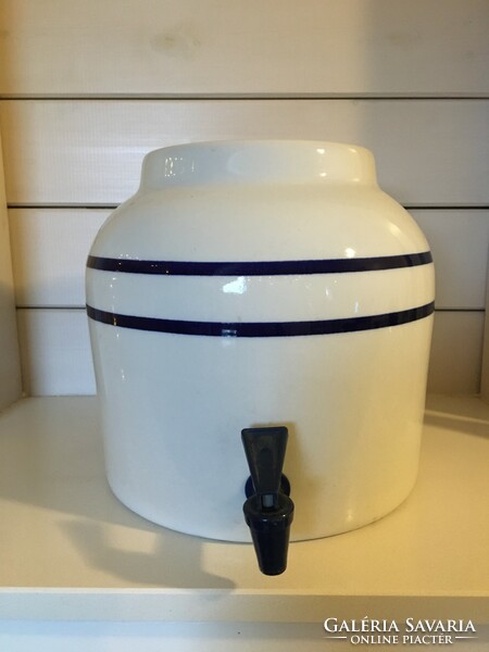 A huge porcelain vessel with a tap