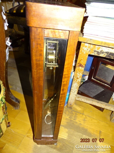 Antique chiseled wall clock mechanism with walker in plain case