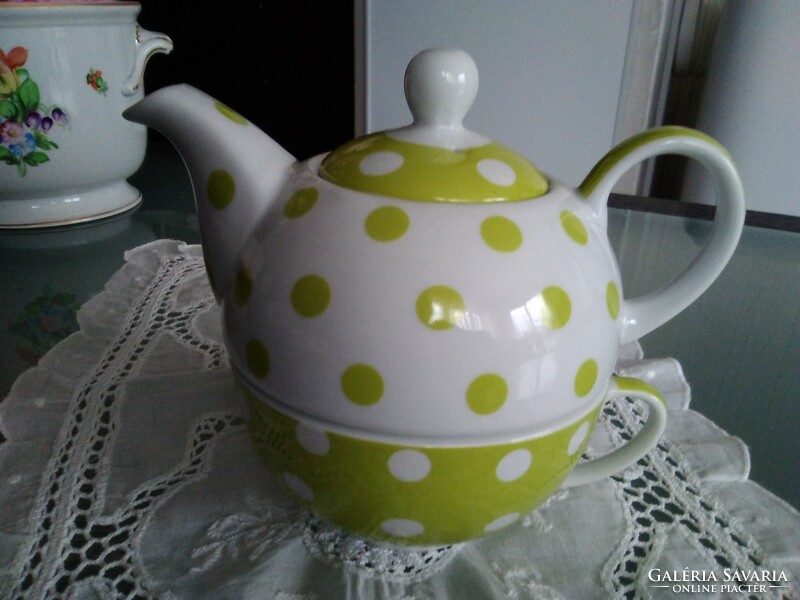Stylish porcelain teapot and cup together with green and white dots, marked.