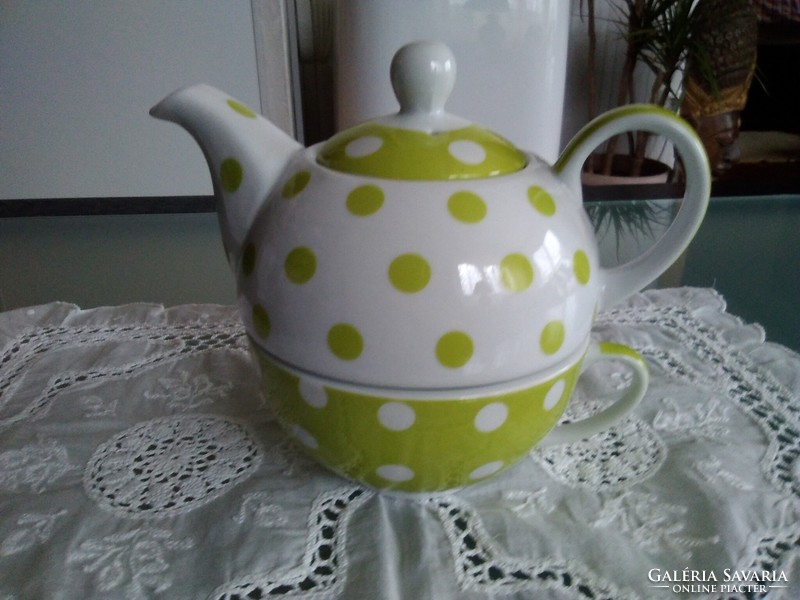 Stylish porcelain teapot and cup together with green and white dots, marked.