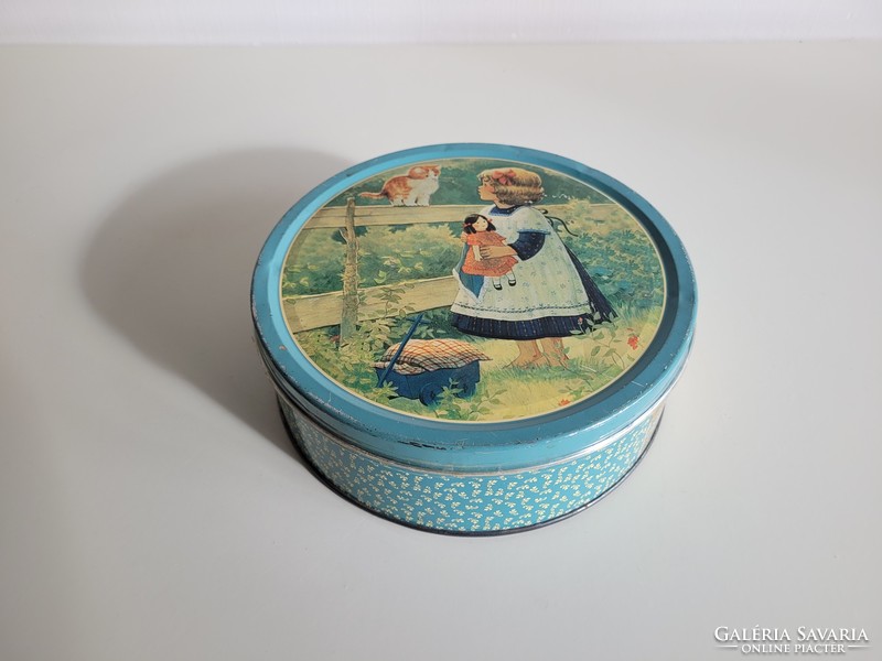 Retro metal biscuit box with a pattern of a little girl and a kitten