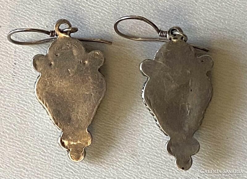 A pair of silver earrings with mineral decoration