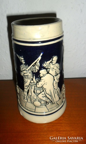Beer mug with German embossed pattern. 13 cm high.