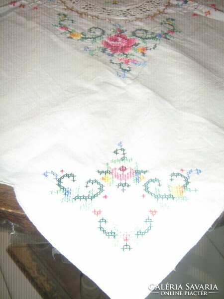 Beautiful crocheted rose tablecloth embroidered with tiny cross stitches