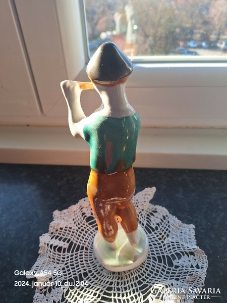 Flute playing boy ceramics