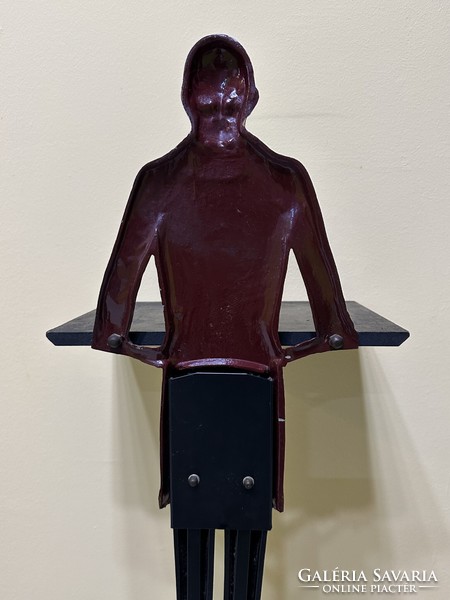 Antique restaurant waiter made of metal, figure holding an ashtray