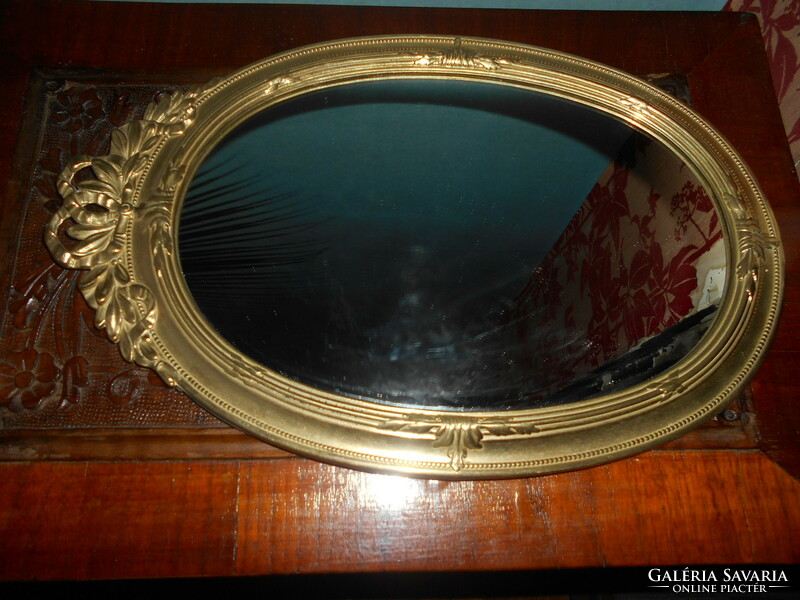 Baroque style wall mirror in a copper frame