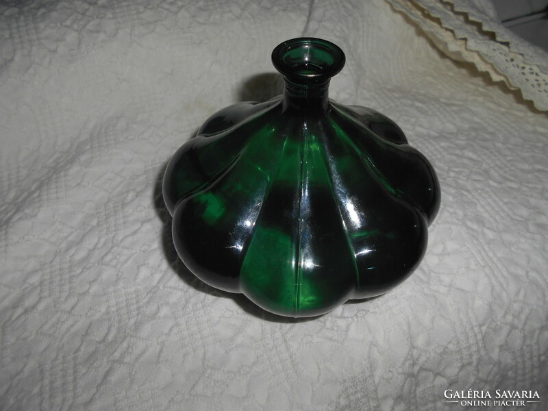 Flower-shaped green glass bottle