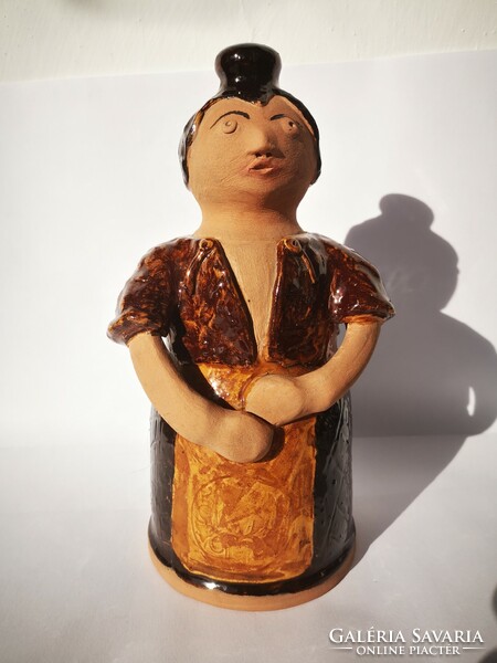 Female figural glazed ceramic bottle