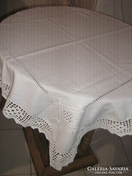 Beautiful white embroidered azure tablecloth with a hand crocheted edge