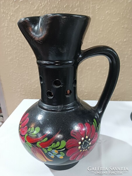 Ceramic jug with a black flower motif