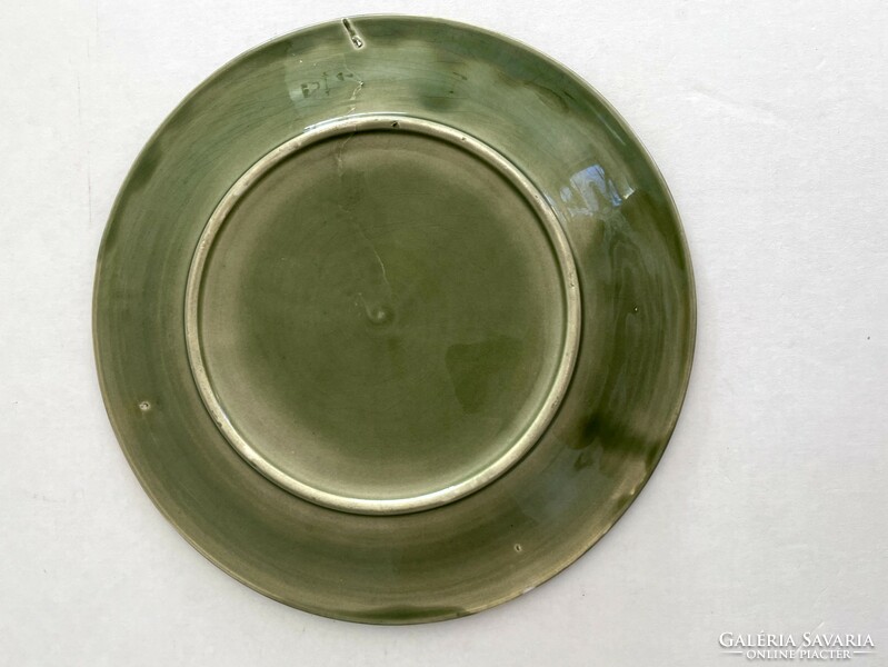 Old, antique green grapes, faience with a leaf pattern, majolica plate