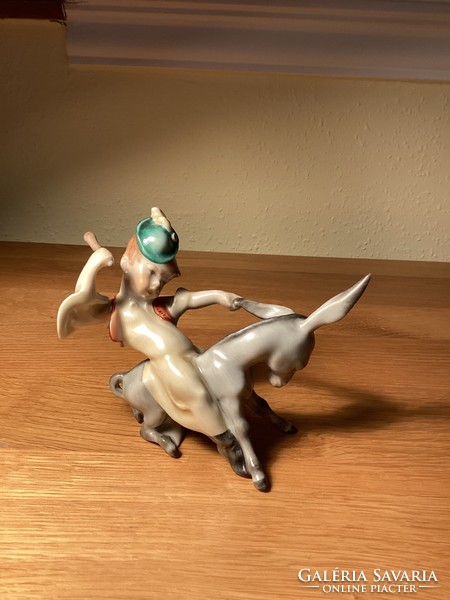 Herend porcelain boy sitting on a donkey.