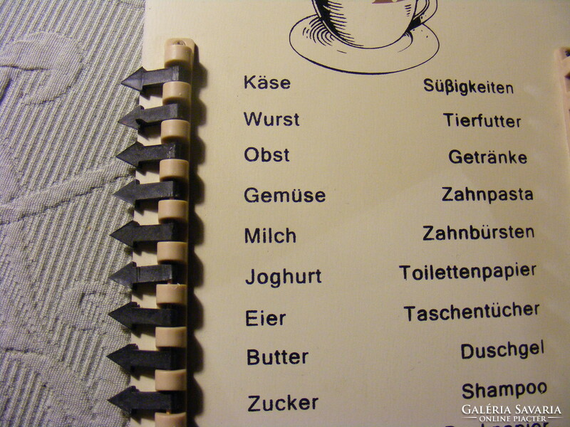Wall shopping list board with marking pins in German - einkaufsliste