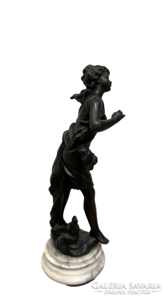 Female statue on a pedestal