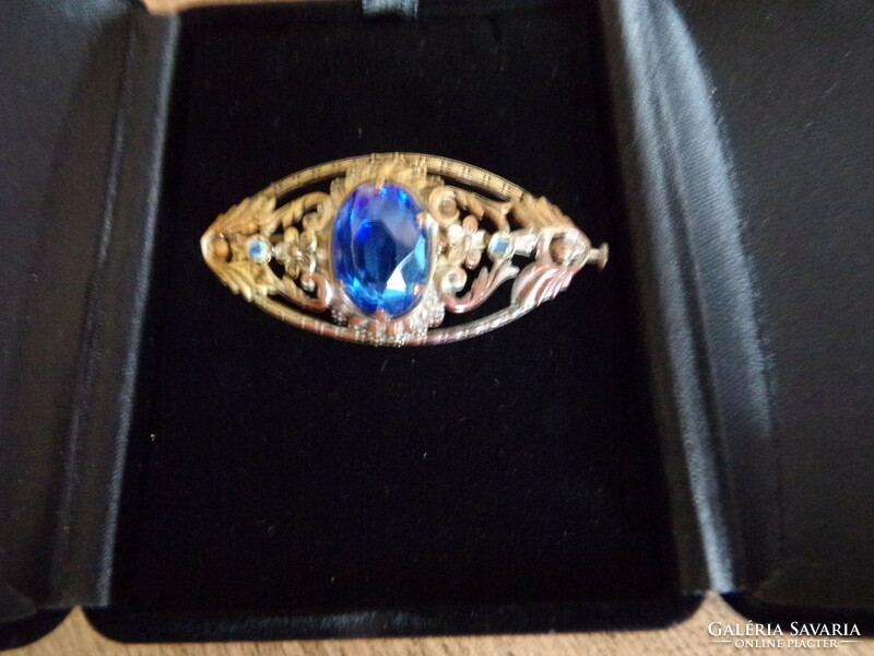 Copper brooch with polished blue stone