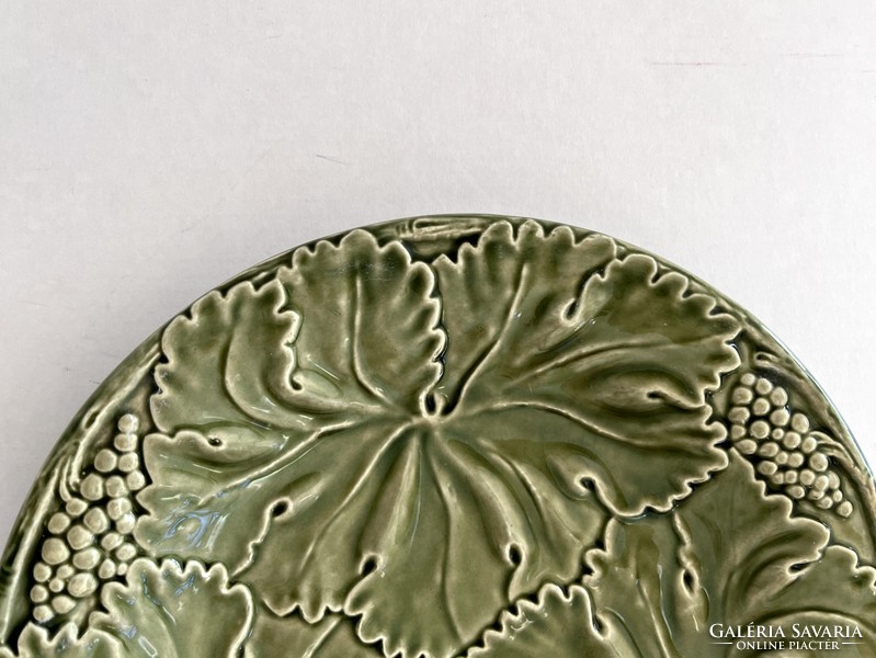 Old, antique green grapes, faience with a leaf pattern, majolica plate