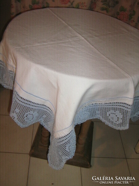 Beautiful handmade crocheted rosy tablecloth with a lacy edge