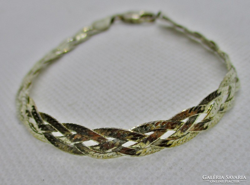 A very beautiful silver bracelet with a delicate braided pattern