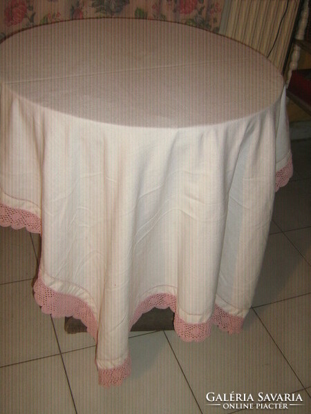 Beautiful azure woven tablecloth with hand-crocheted mauve pink wide lace