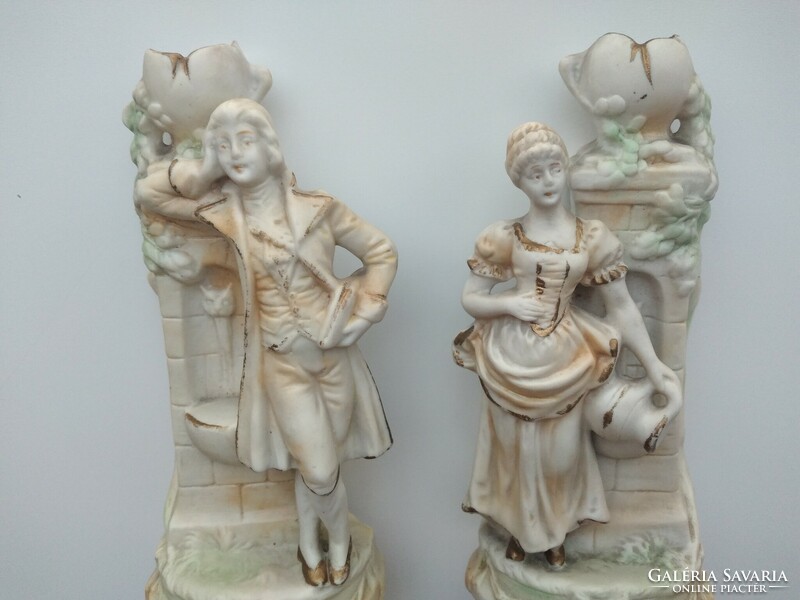 Pair of biscuit porcelain candle holders