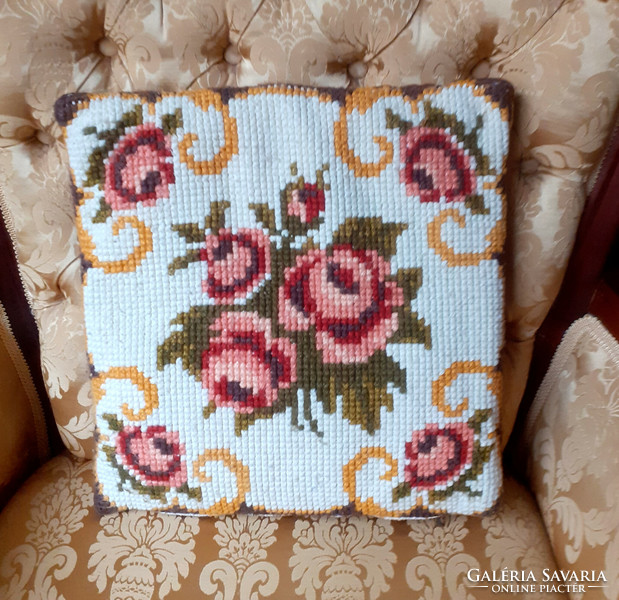 Pink tapestry decorative pillow with filling.