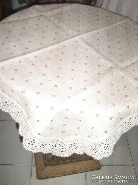 Beautiful hand-crocheted woven tablecloth with a small pattern with a lace edge