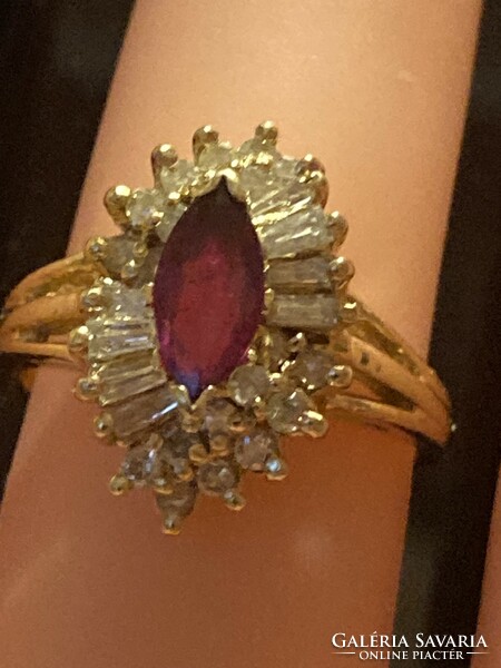 14K gold ring embellished with diamonds and ruby gemstones