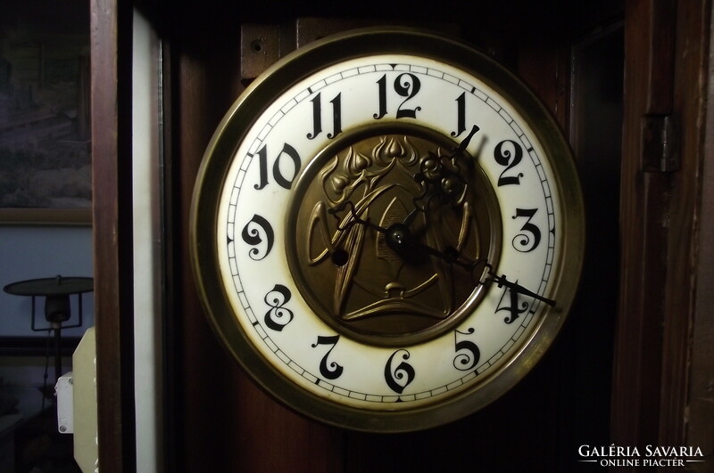 Art Nouveau, chiseled, two-weight wall clock.