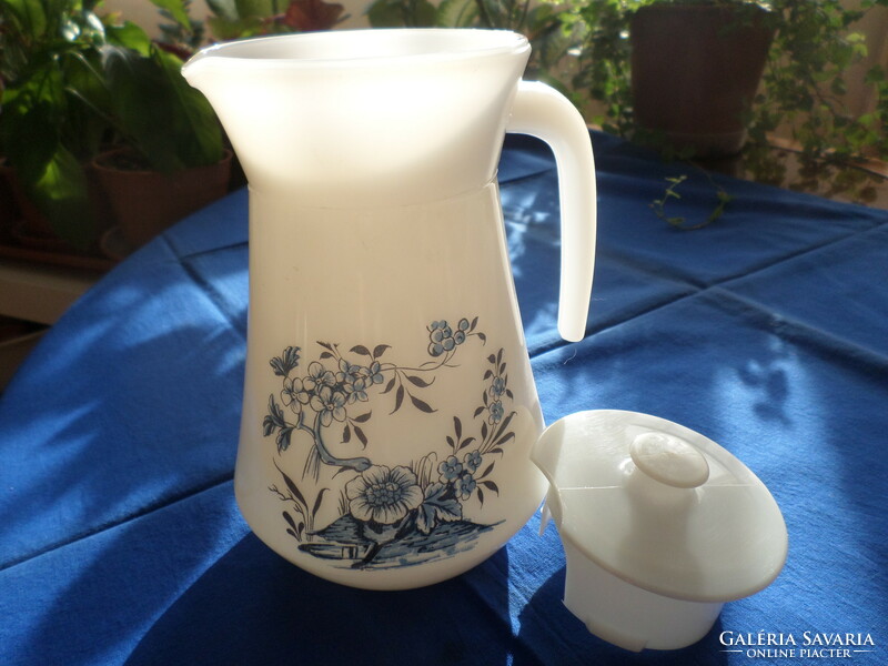 New! Blue flower patterned milk glass with jug/lid. It has not been used. Jena