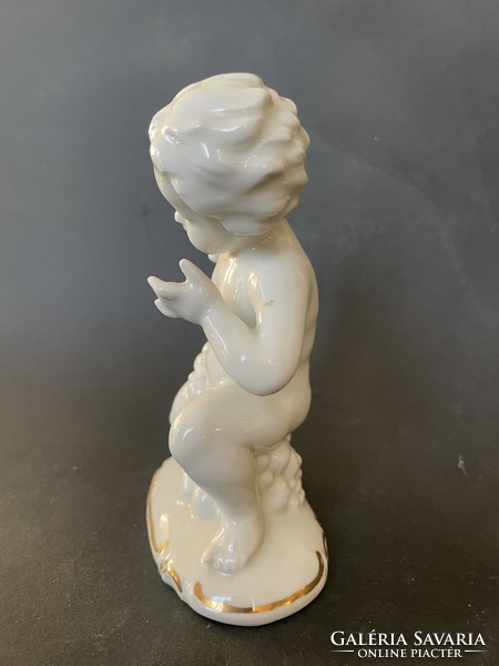 GDR German porcelain putto with candle holder