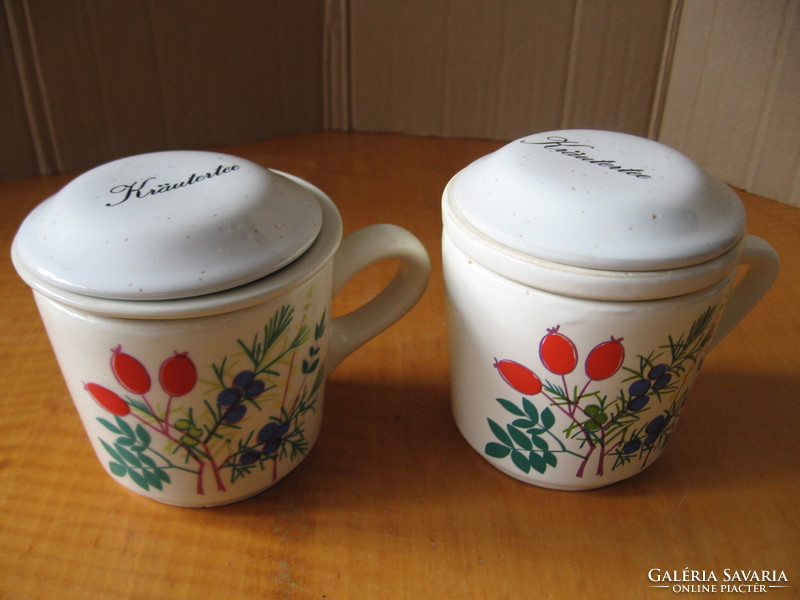 A pair of mugs with herbs and wildflowers, a pair of waechtersbach ceramic filter mugs with a lid