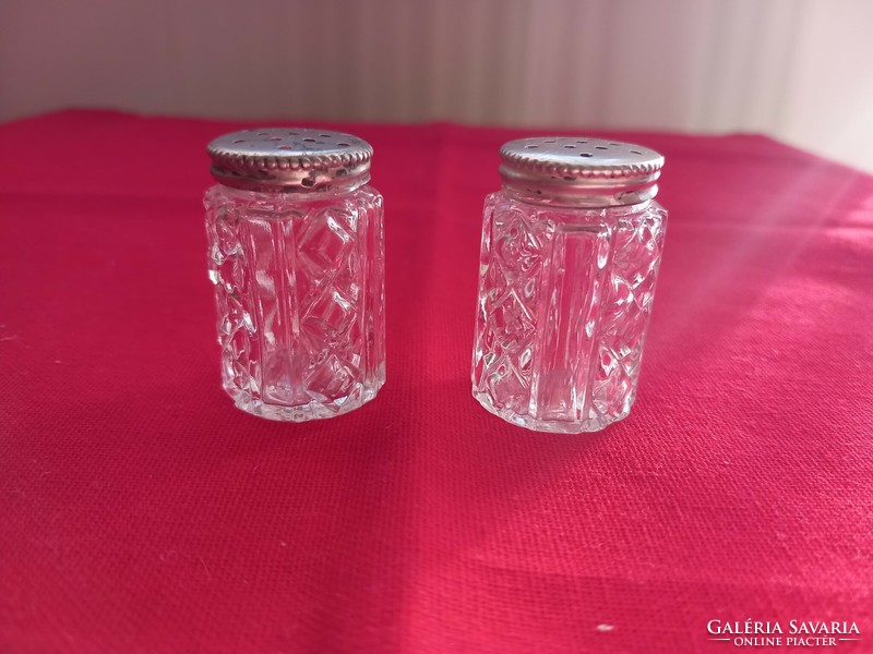 Salt and pepper shakers with silver caps
