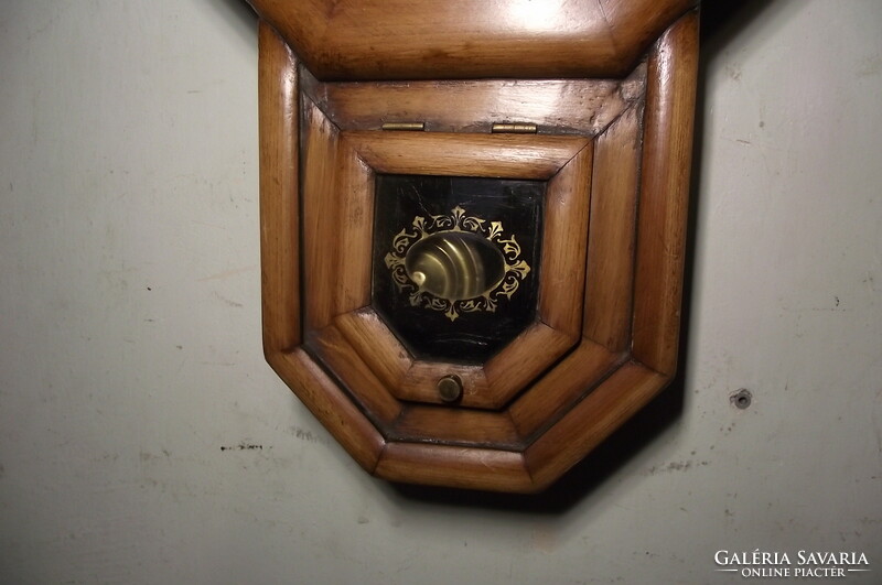 Antique, octagonal swing wall clock.