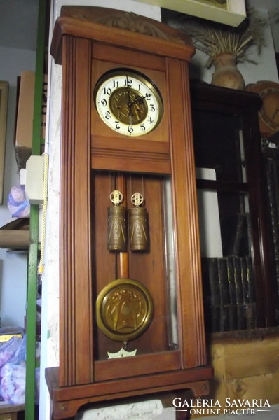 Art Nouveau, chiseled, two-weight wall clock.