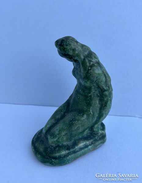 Ceramic sculpture of a seated woman