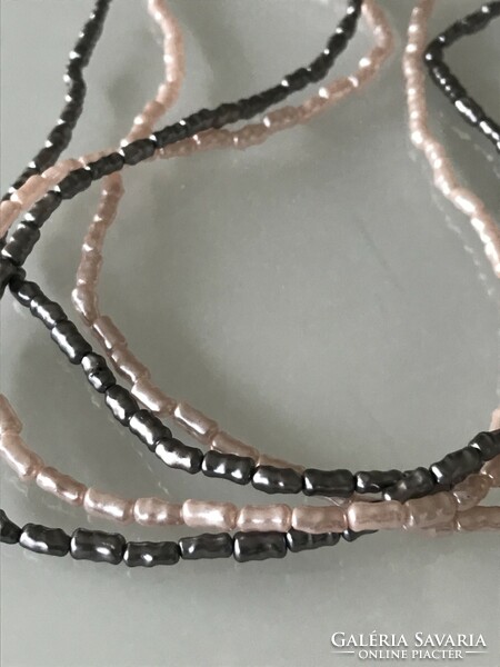 Necklaces with mother-of-pearl luster made of elongated beads, 76 cm long