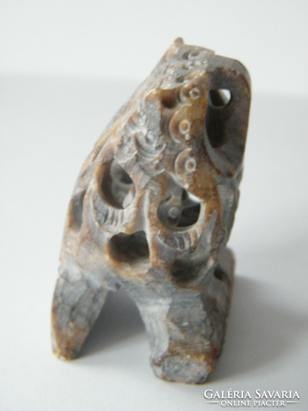 Hand-carved stone owl with a smaller owl inside