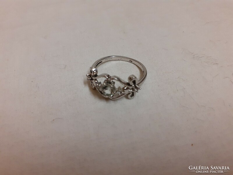 A marked silver ring in good condition, set with a white polished set stone