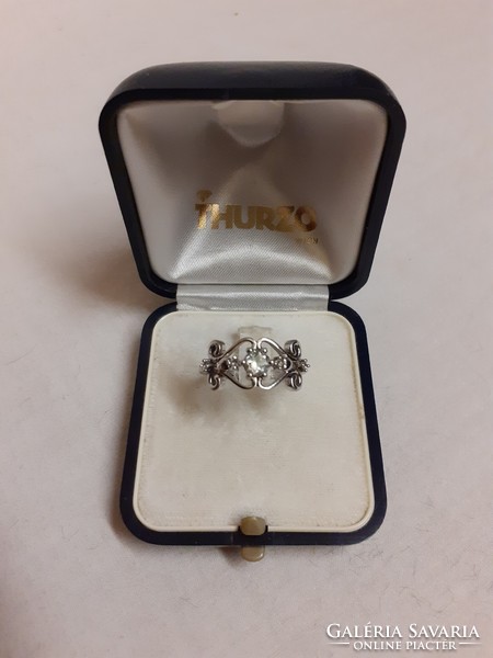 A marked silver ring in good condition, set with a white polished set stone