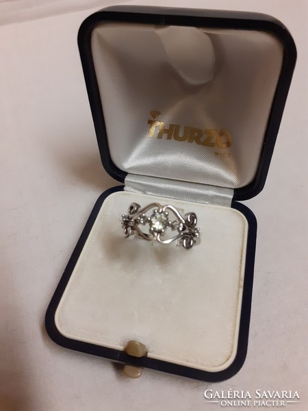 A marked silver ring in good condition, set with a white polished set stone