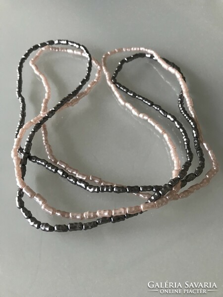 Necklaces with mother-of-pearl luster made of elongated beads, 76 cm long