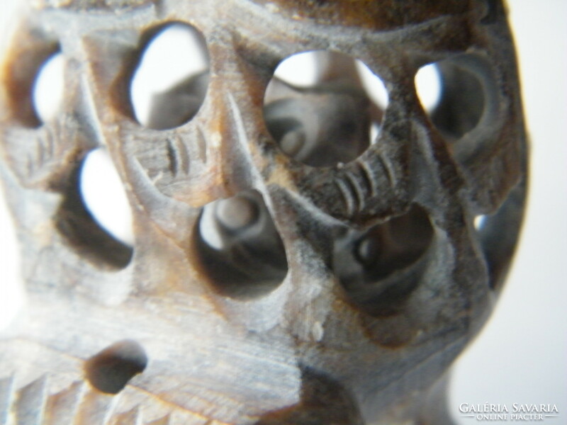 Hand-carved stone owl with a smaller owl inside