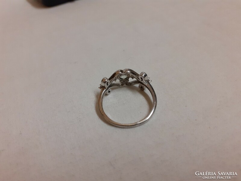 A marked silver ring in good condition, set with a white polished set stone