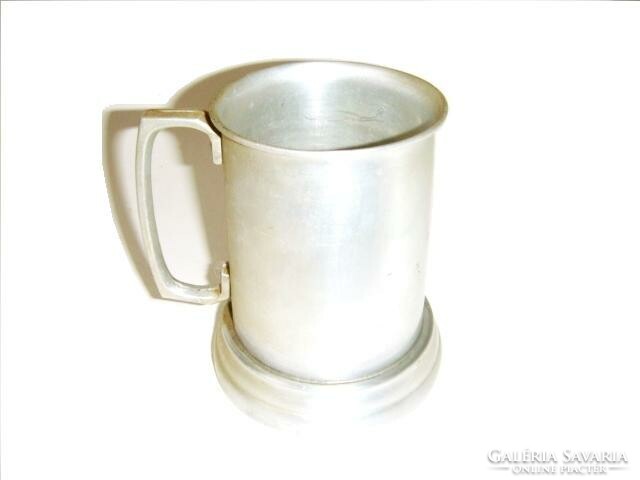 Aluminum mug with a transparent bottom. Beautiful silver colored unique cup...