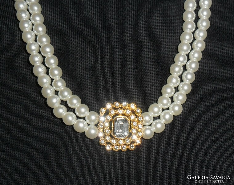 Elegant, beautiful, shiny double row of pearls with a pendant decorated with stone and zirconia.