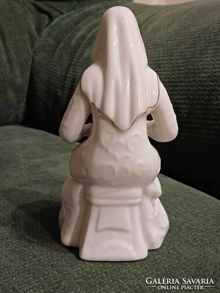 A charming porcelain statue of a mother with her child