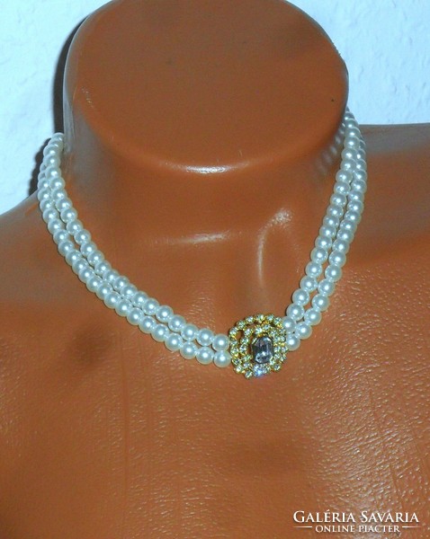 Elegant, beautiful, shiny double row of pearls with a pendant decorated with stone and zirconia.